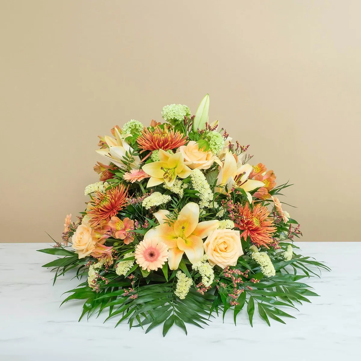 Funeral composition in gold tones